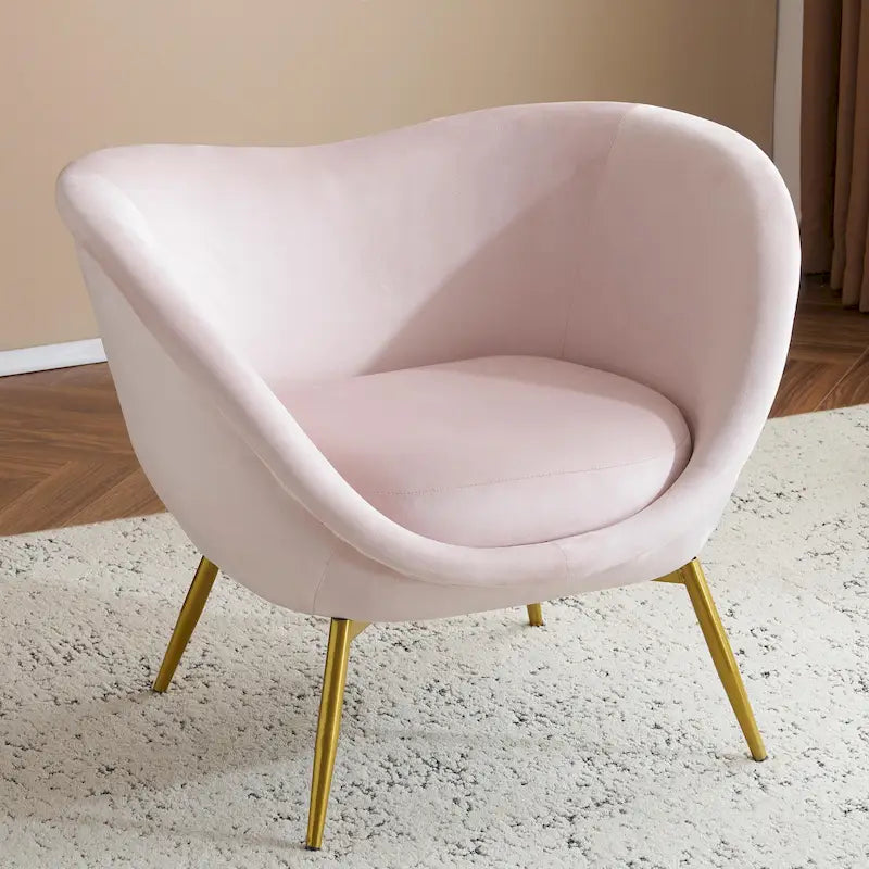 Fauteuil de salon moderne rembourré en peluche avec dossier incurvé et pieds dorés.